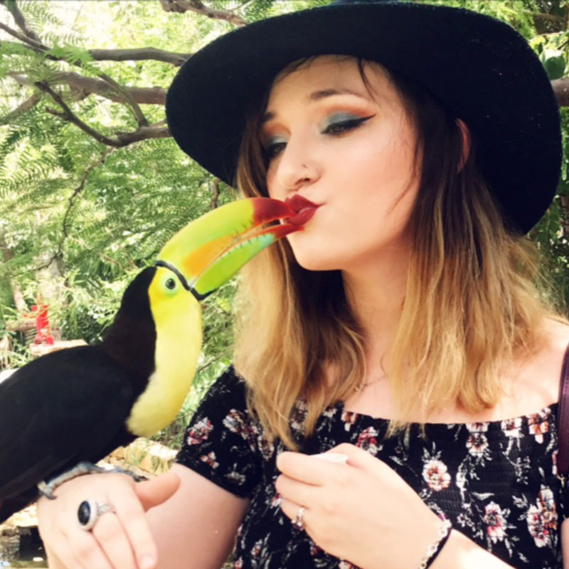 guest kissing a bird