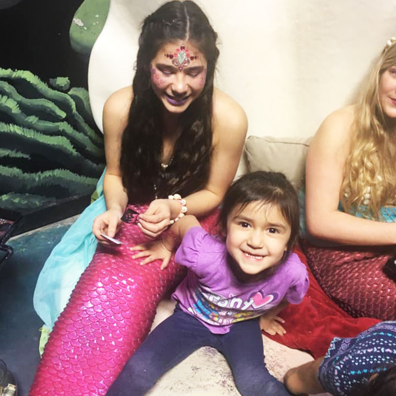 Young guests meet mermaids