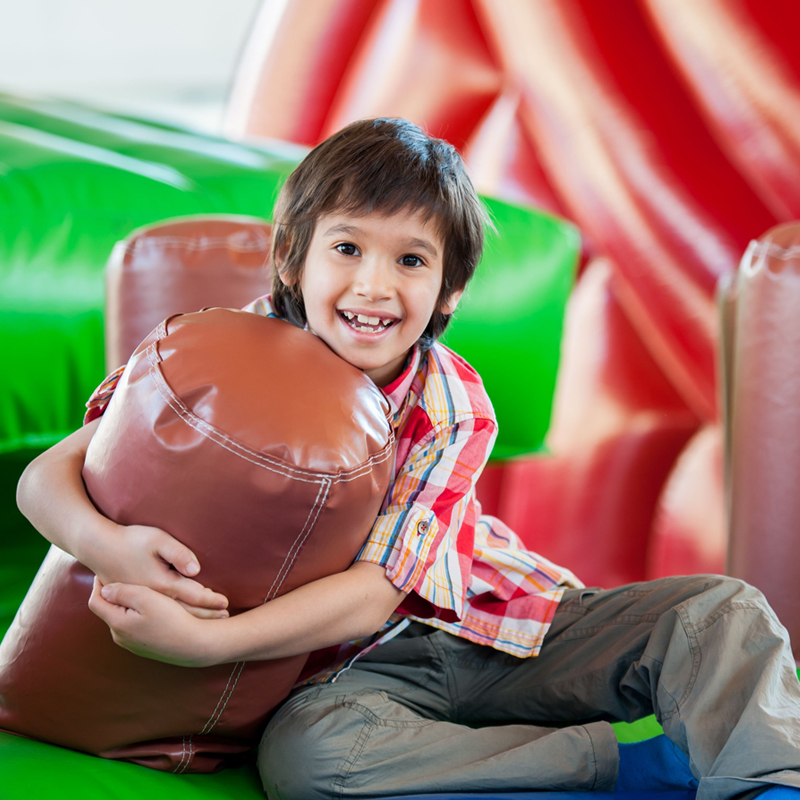 Child playing in bounce house Child playing in bounce house