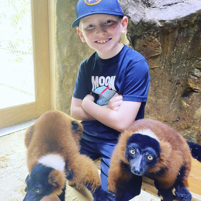 BOY WITH RED RUFFED LEMURS-01
